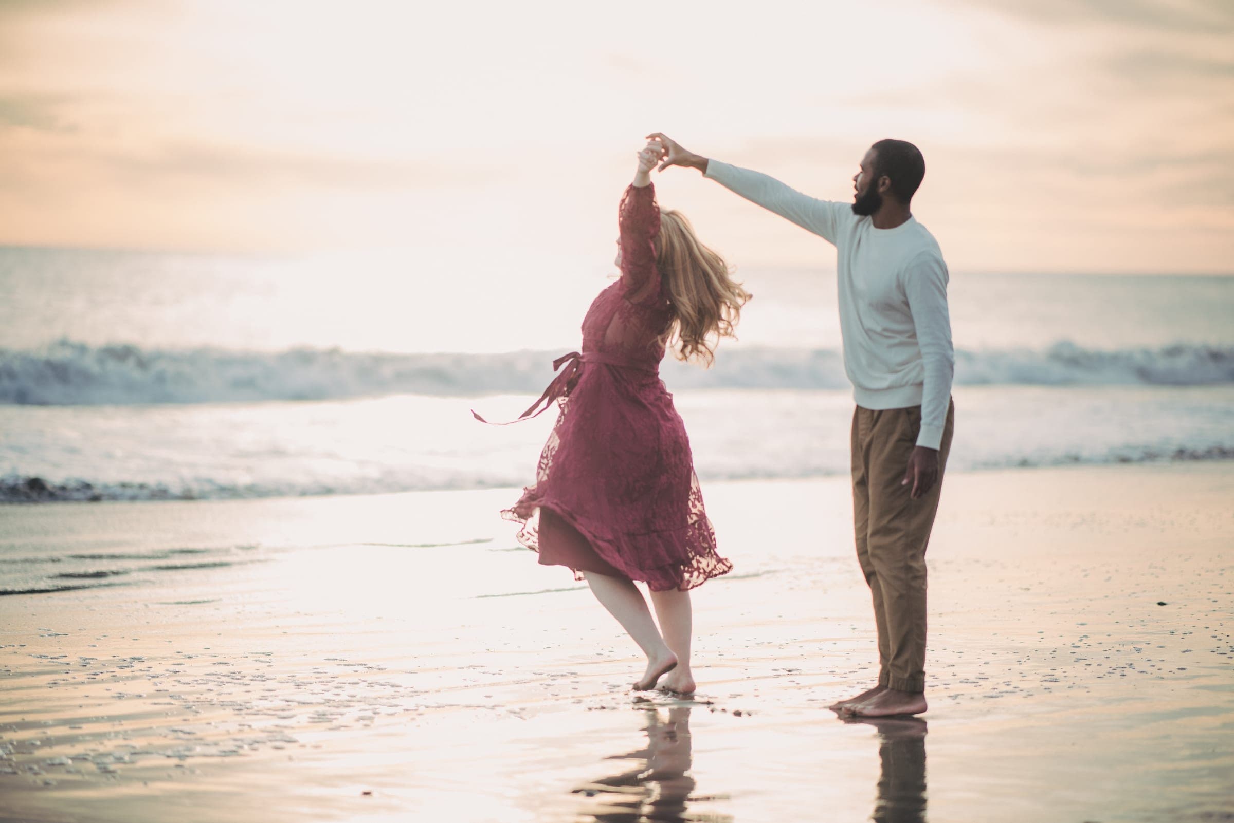 Engagement session dancing on the beach