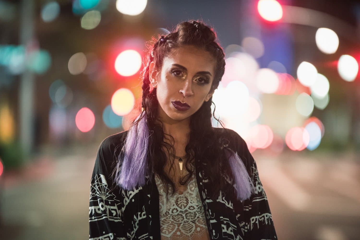 Night portrait with city bokeh