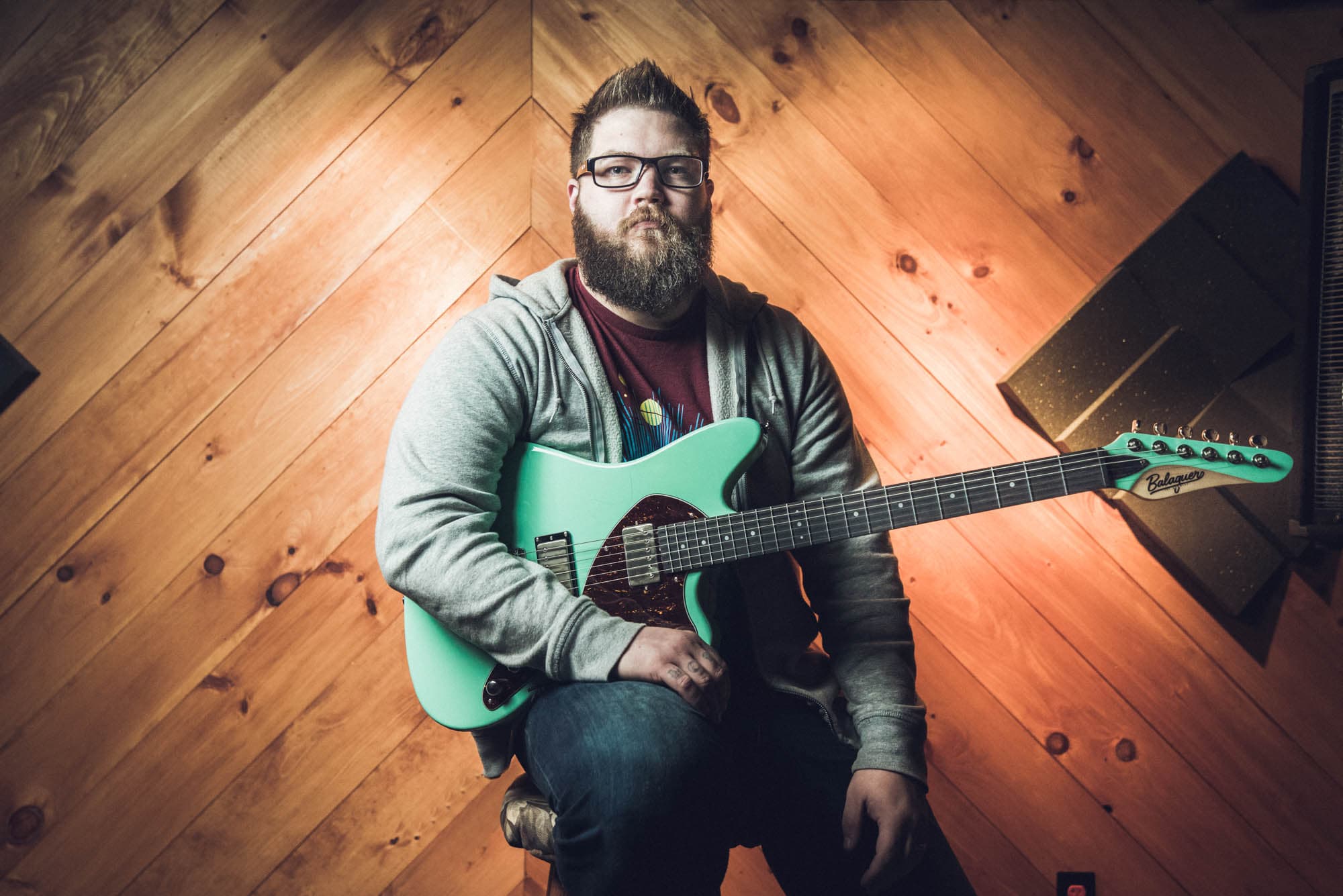 Portrait of a musician with his guitar