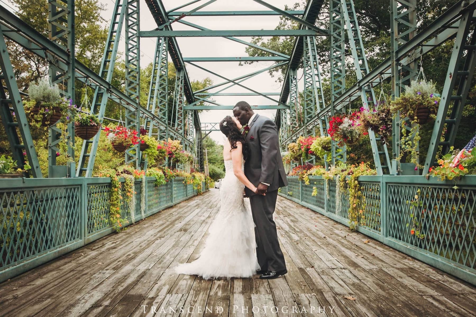 Wedding couple on the flower bridge