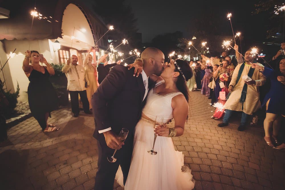 Sparkler send-off kiss at night