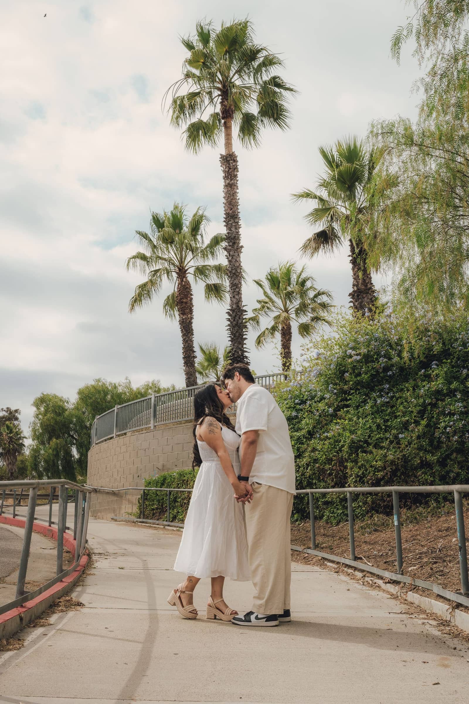 Engagement session among palm trees