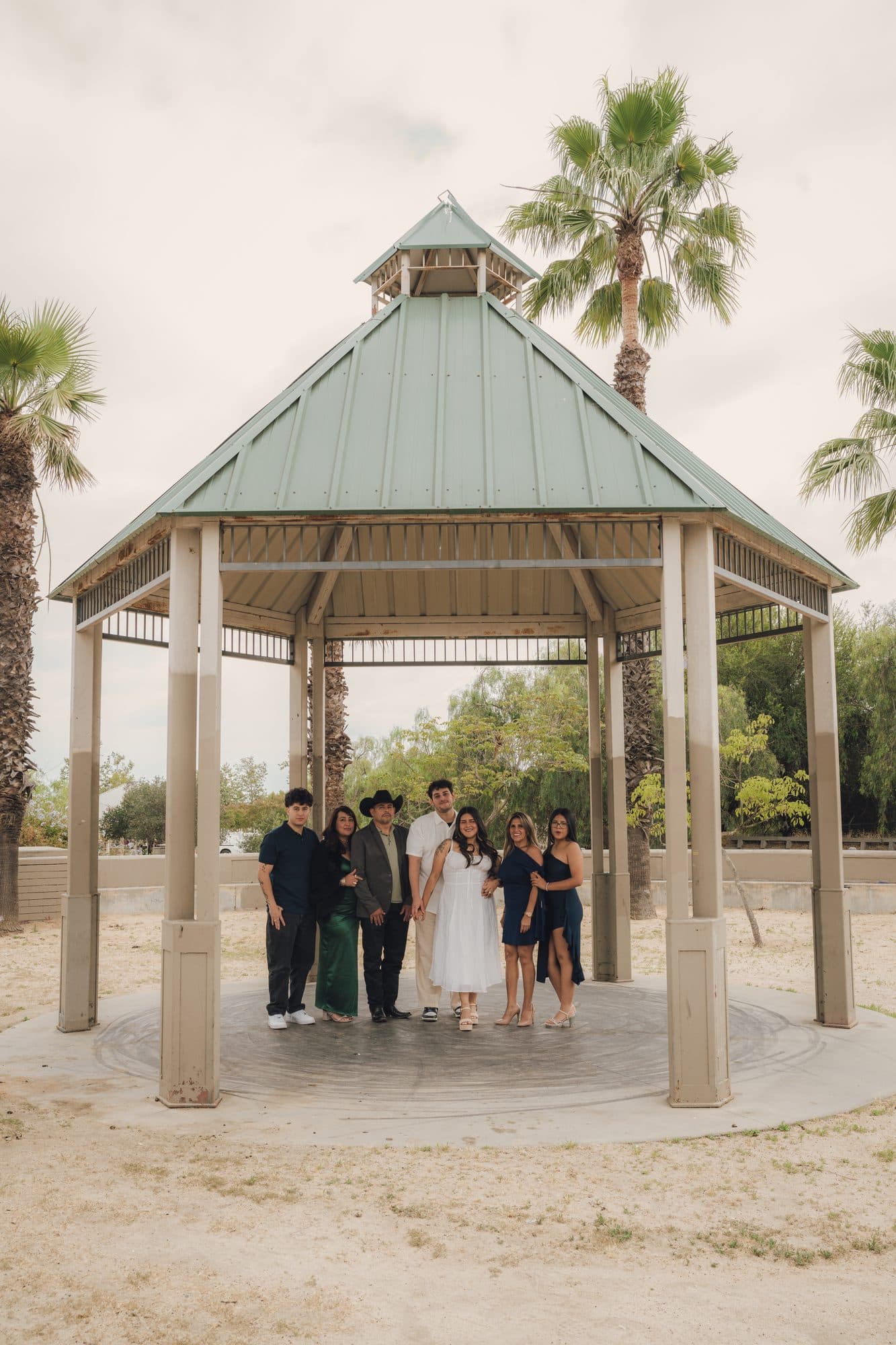 Extended family gathered under a park gazebo in Los Angeles