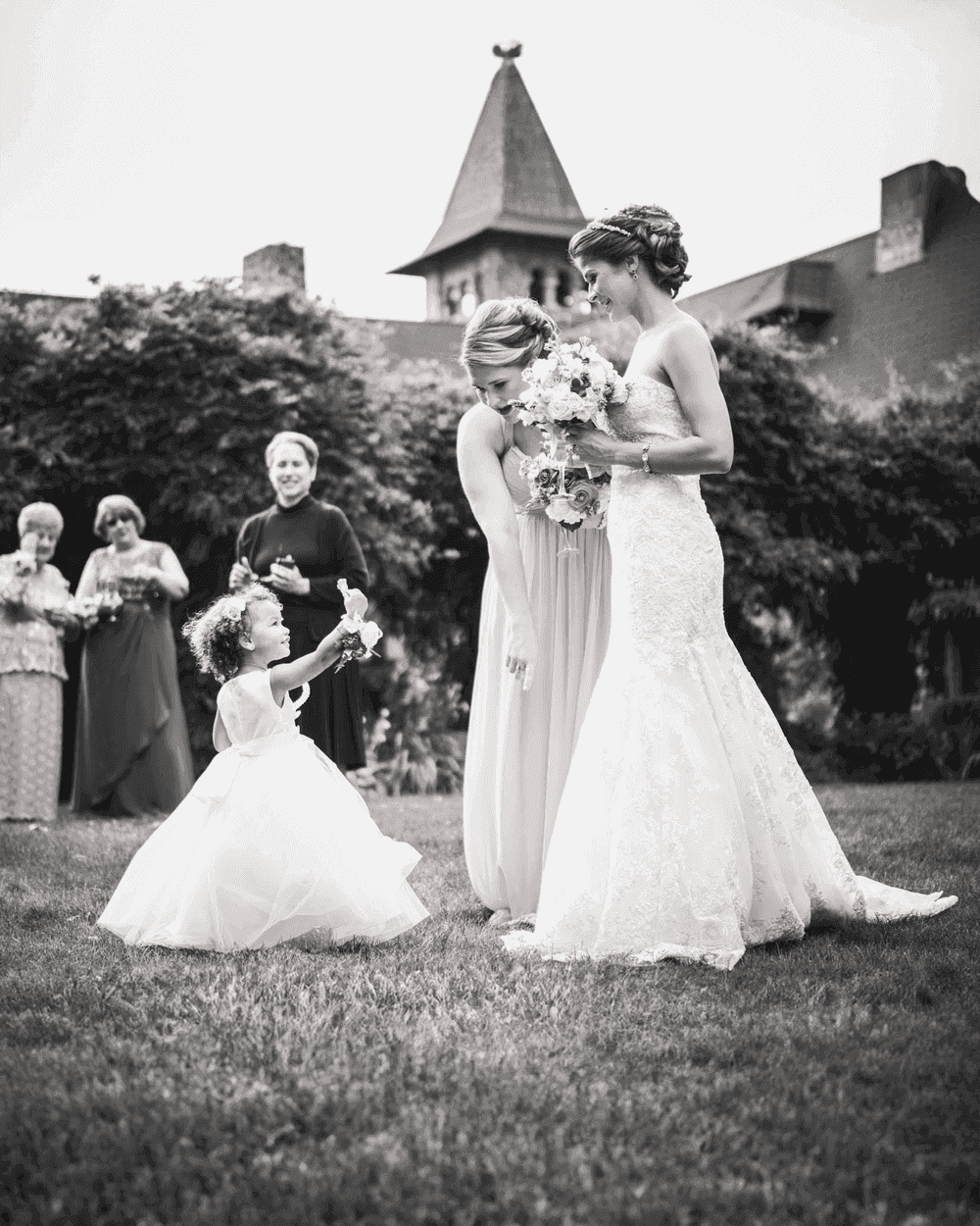 Bride with flower girl in black and white